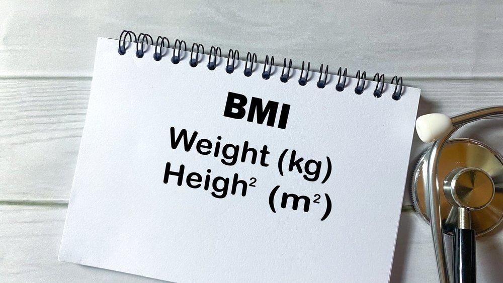 Person using a BMI calculator on a smartphone with a health tracking app Person using a BMI calculator on a smartphone with a health tracking app